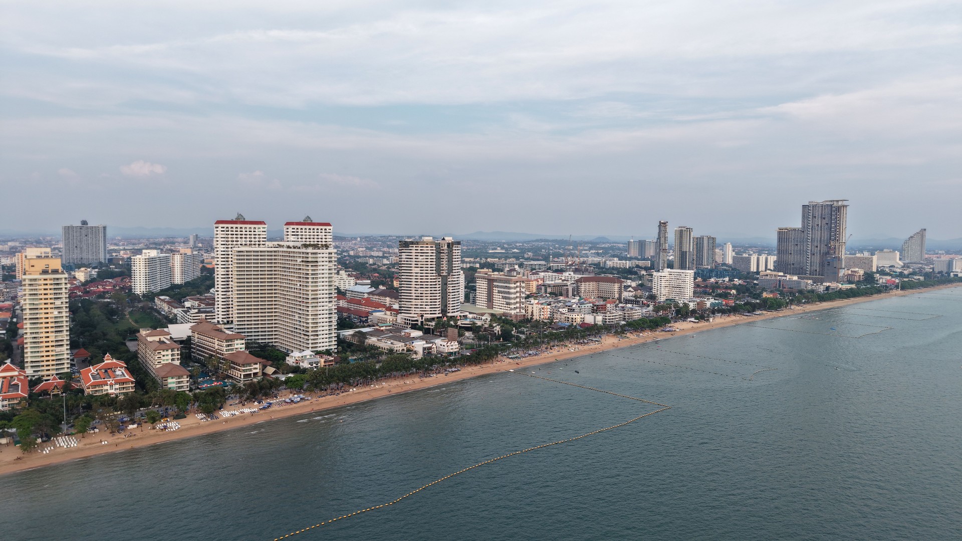 Pattaya city skyline dominating the coastline at twilight in thailand
